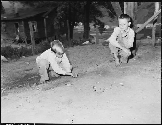 Boys playing marbles in 1946